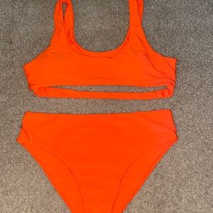 Women’s bright orange bikini